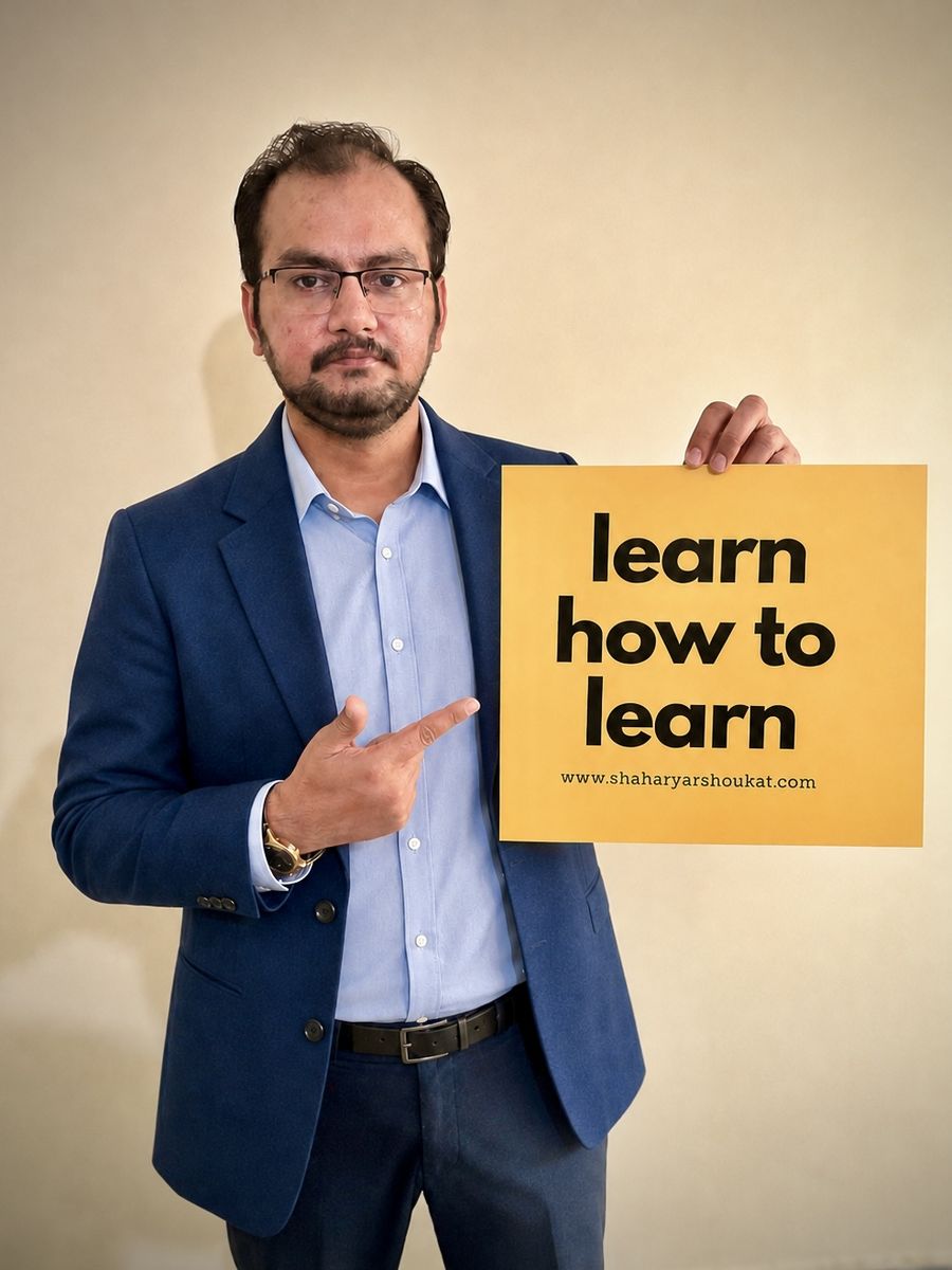 Shaharyar Shoukat holding a sign that reads: learn how to learn